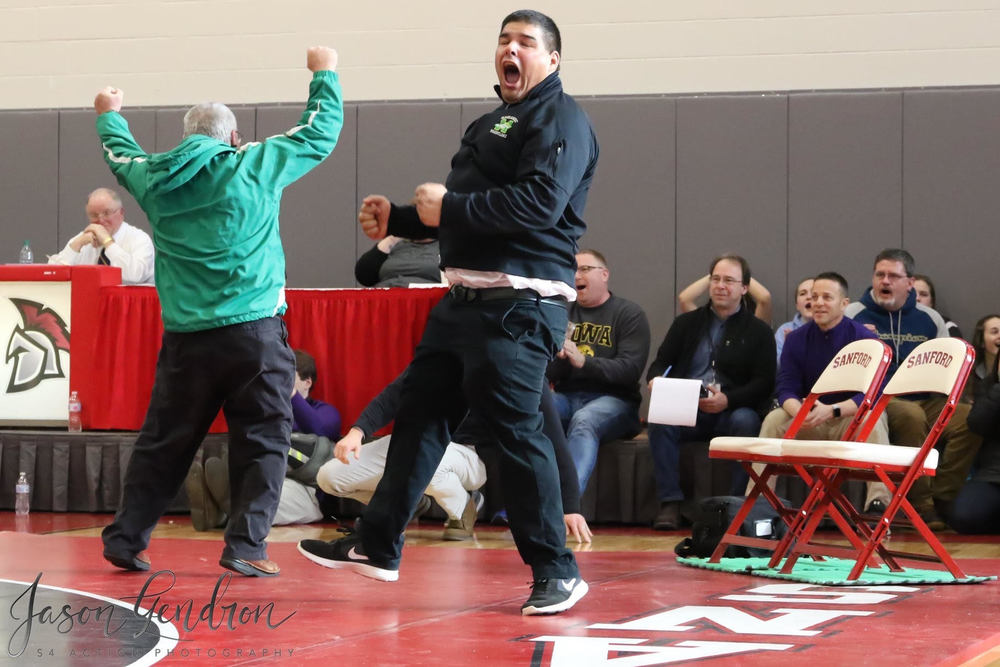 MHS Wrestling Coach D and Coach Ed celebrate after a win!