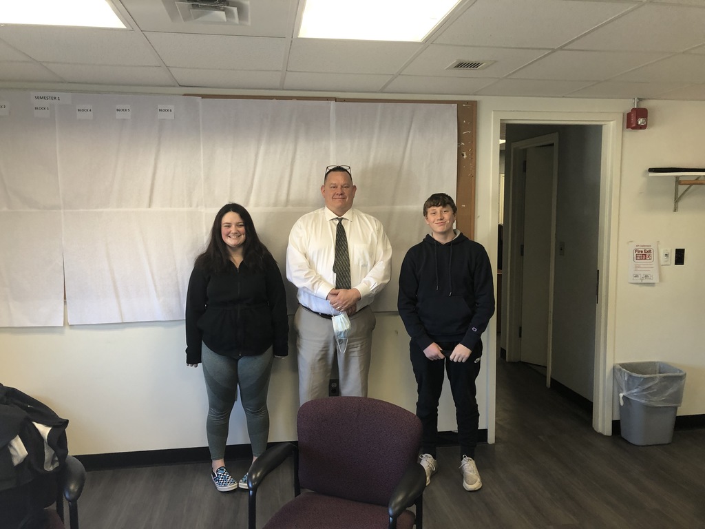 Photo of Principal with 2 students