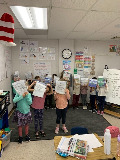 Ms. Secunde's class holding thank-you notes.