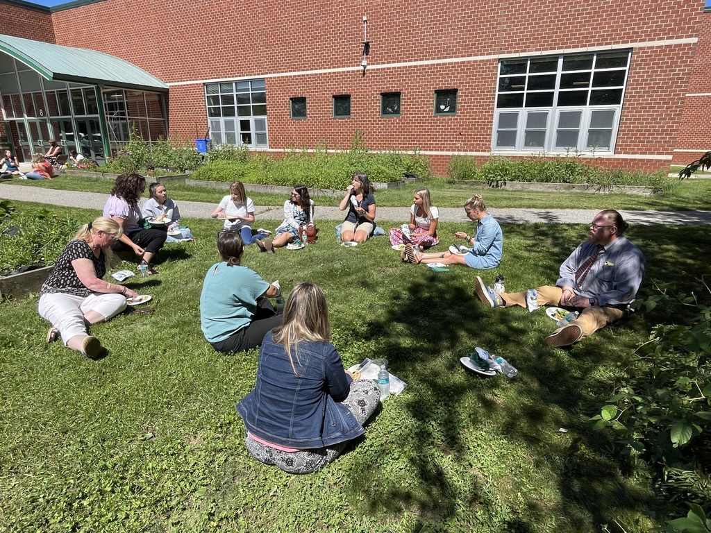 staff outside MMS enjoying lunch